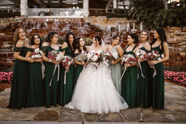Bride and Bridesmaids Smiling with Bouquets