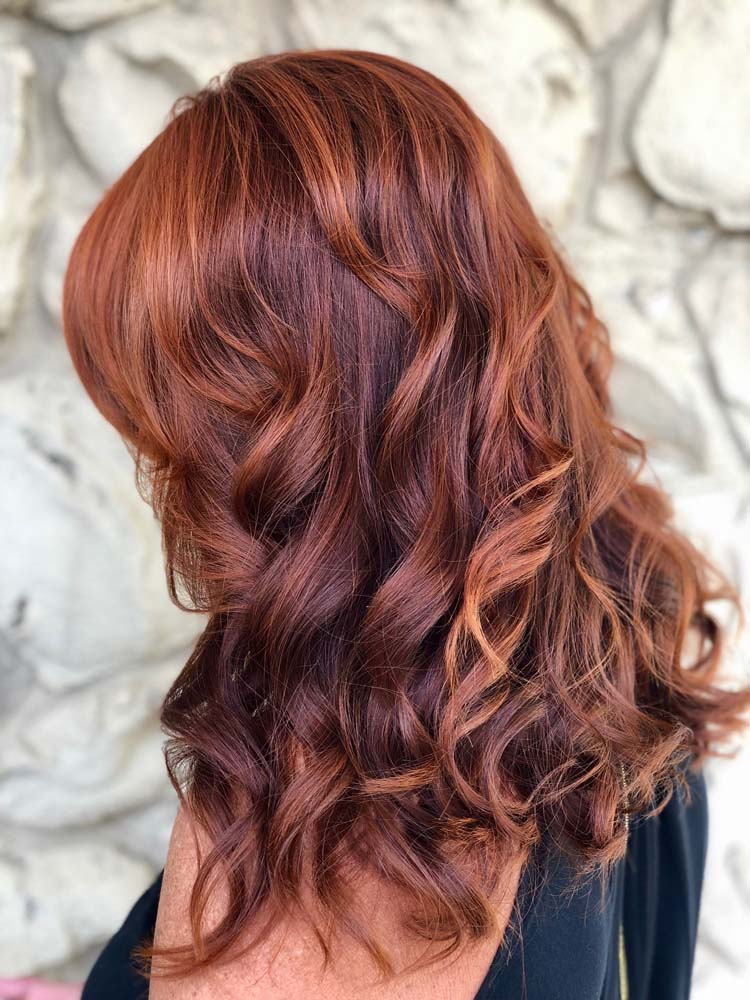 Woman with Curled, Red Hair Styled by Mary Rando